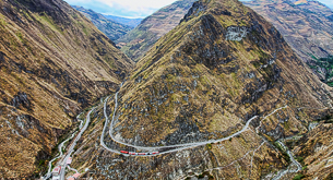 Descend a precipitous rock face by train